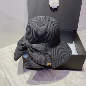 Valentino Garavani Bow Straw Bucket Hat with VLogo In Black