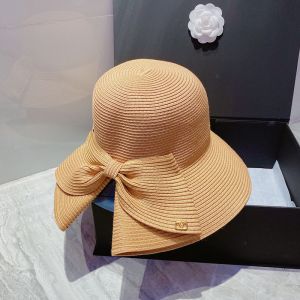 Valentino Garavani Bow Straw Bucket Hat with VLogo In Brown