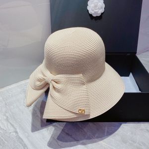Valentino Garavani Bow Straw Bucket Hat with VLogo In White